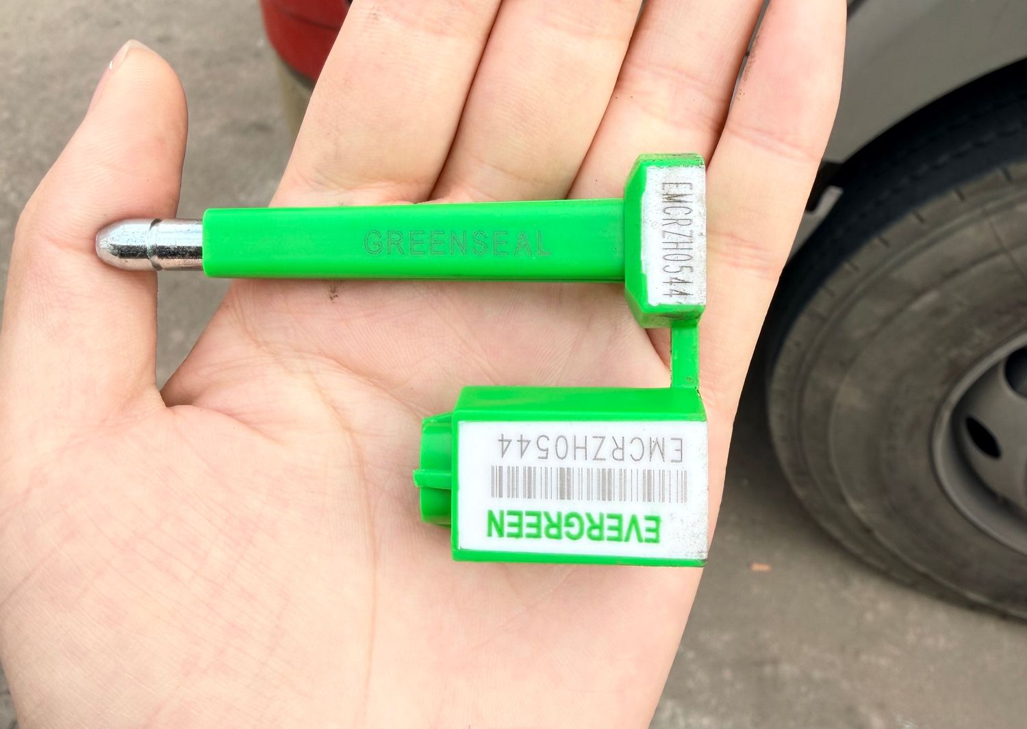 Numbered bolt seal photographed before it is fitted to the container doors